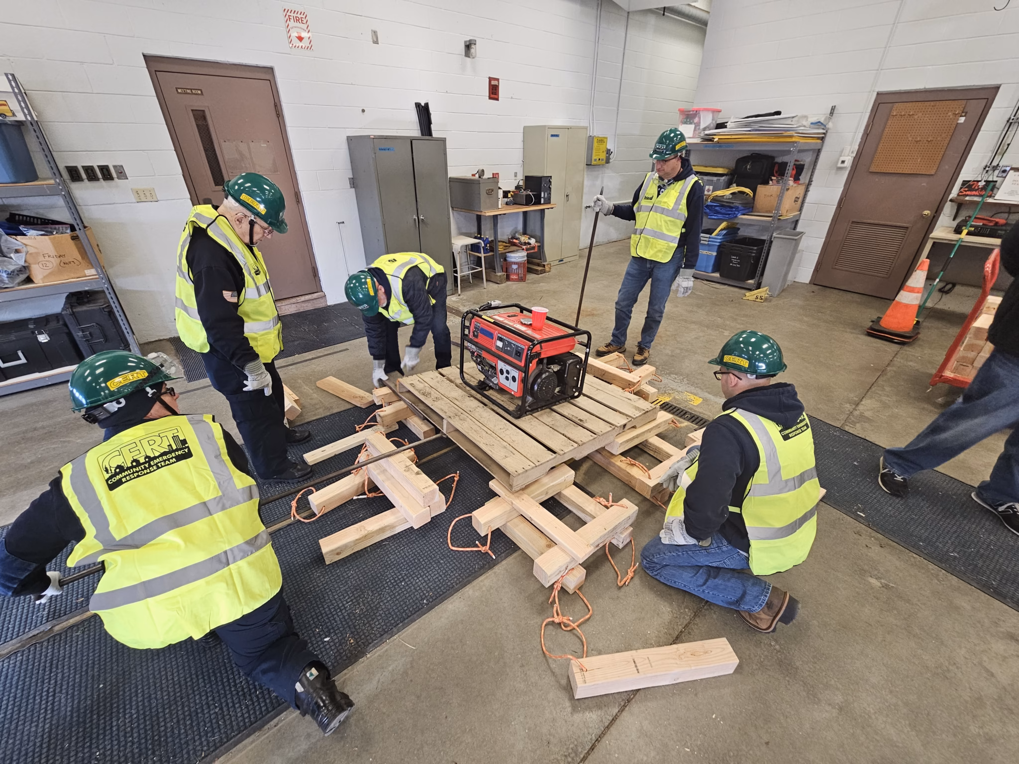 A team cribs under a load during light search and rescue practice