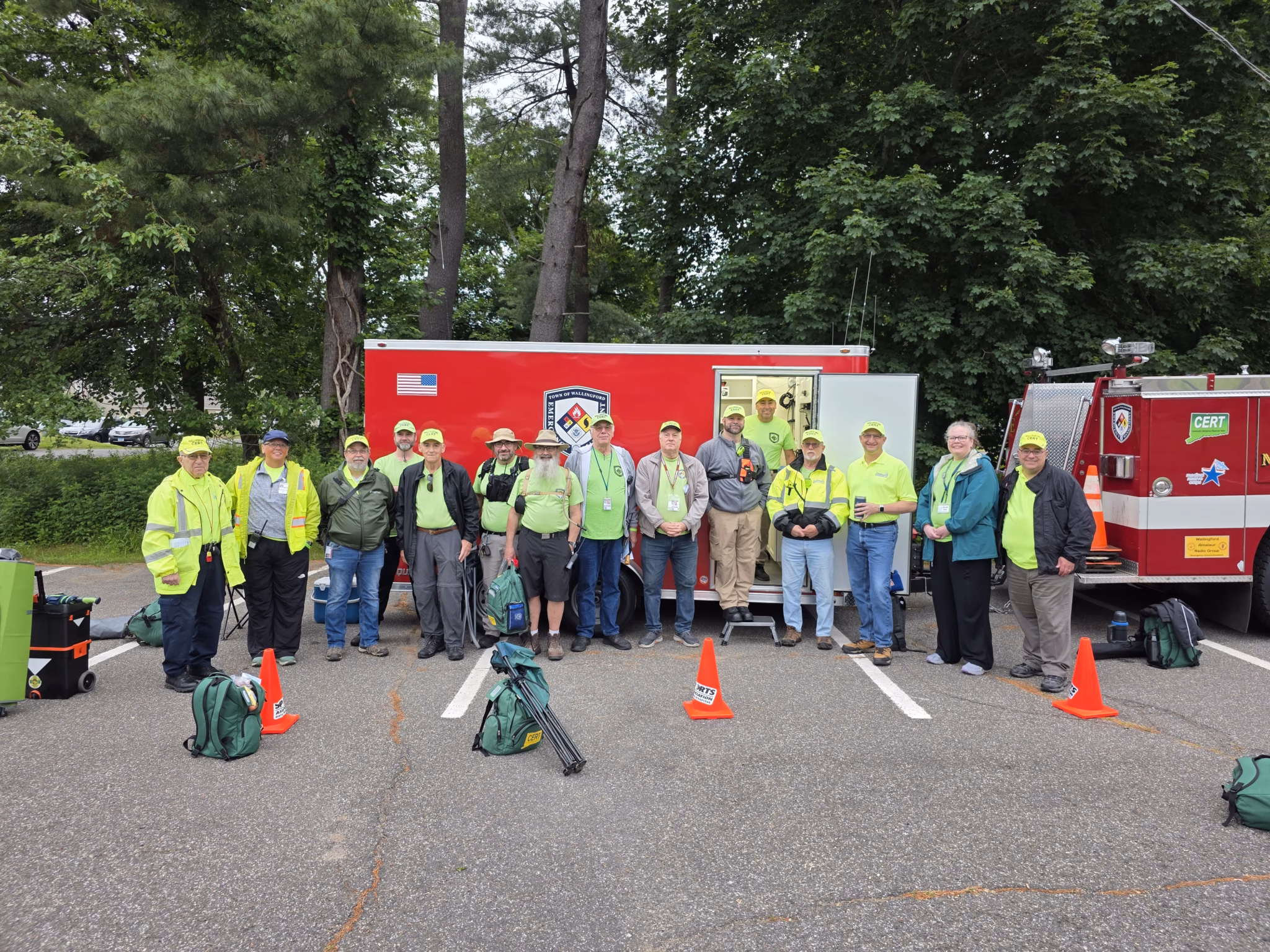 Wallingford CERT volunteers lined up in front of the OEM trailer and a fire engine