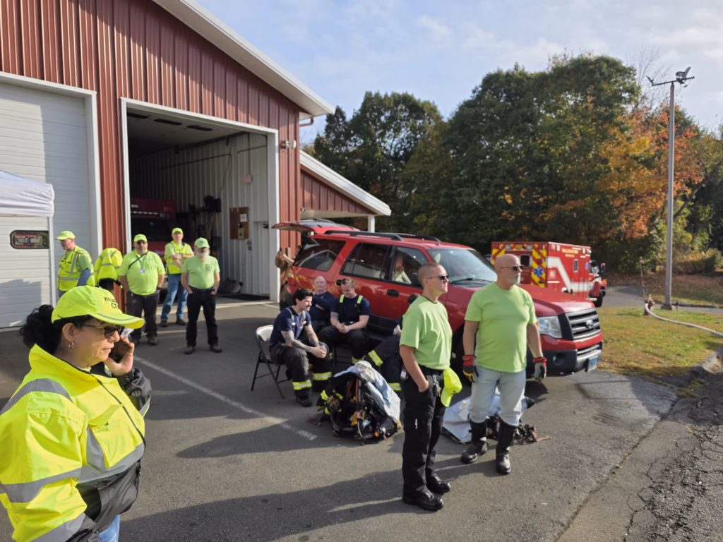 CERT members tend to firefighters outside the fire station