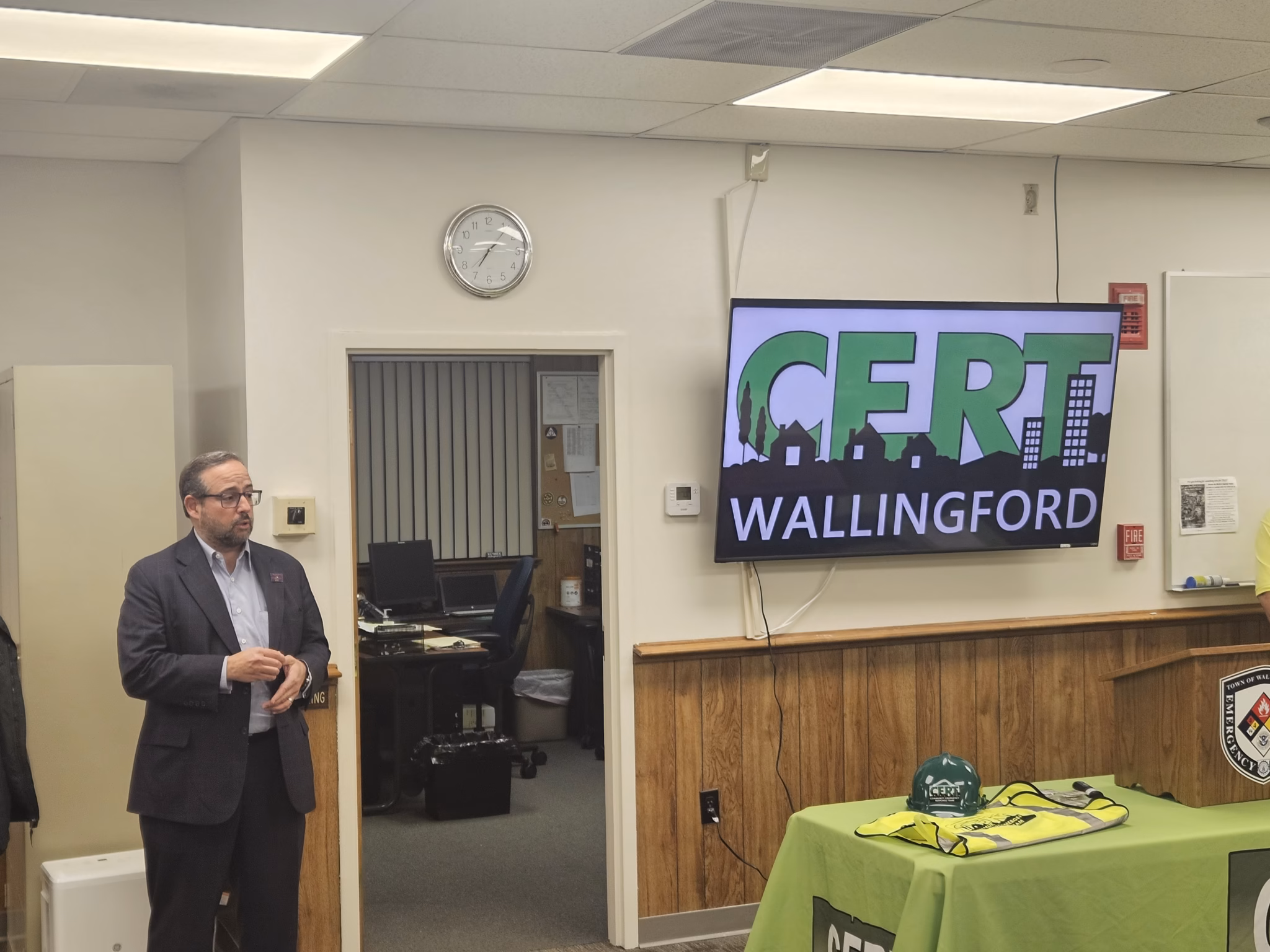 A speaker addresses the graduating CERT class