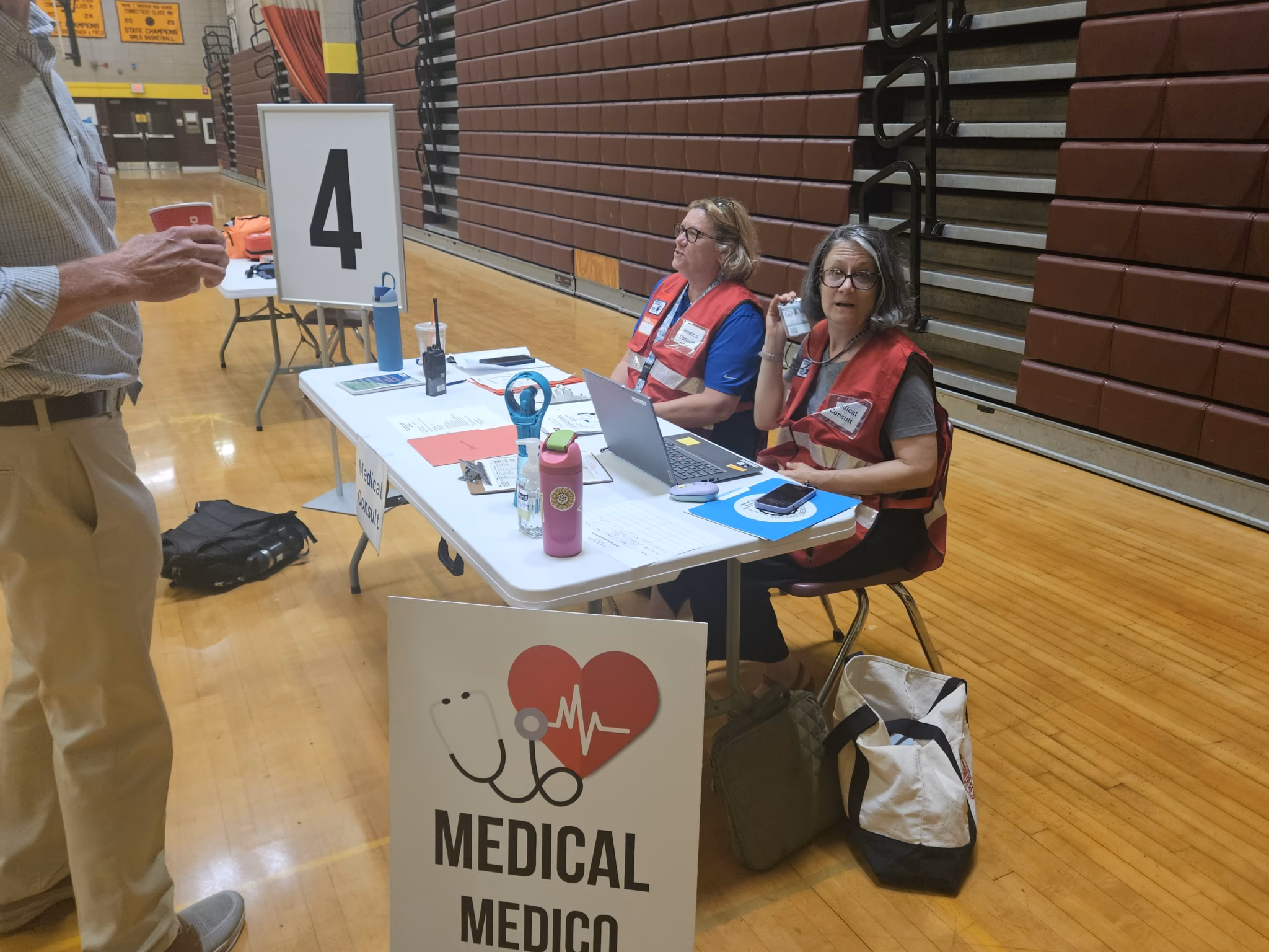 Volunteers at the medical station table