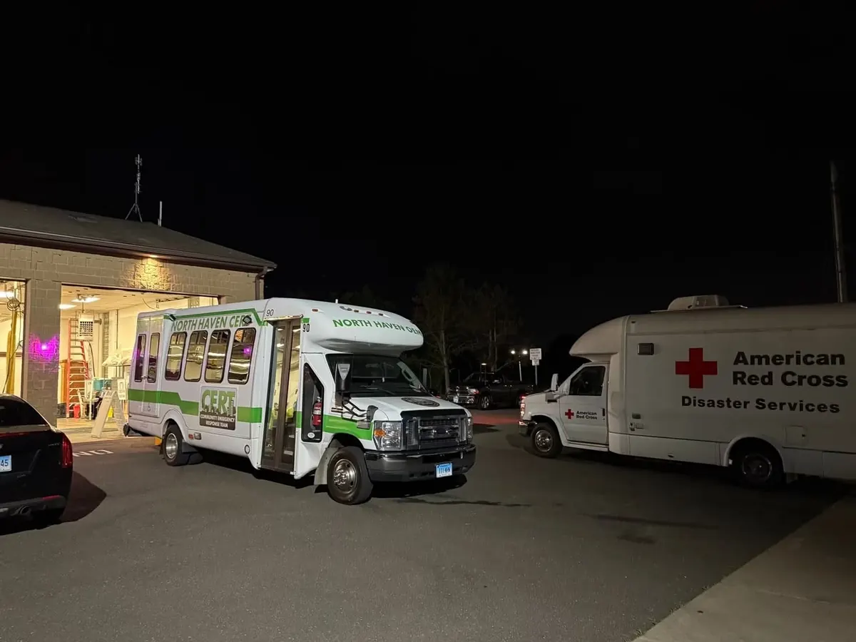 Response vehicles at night after two fires in Wallingford
