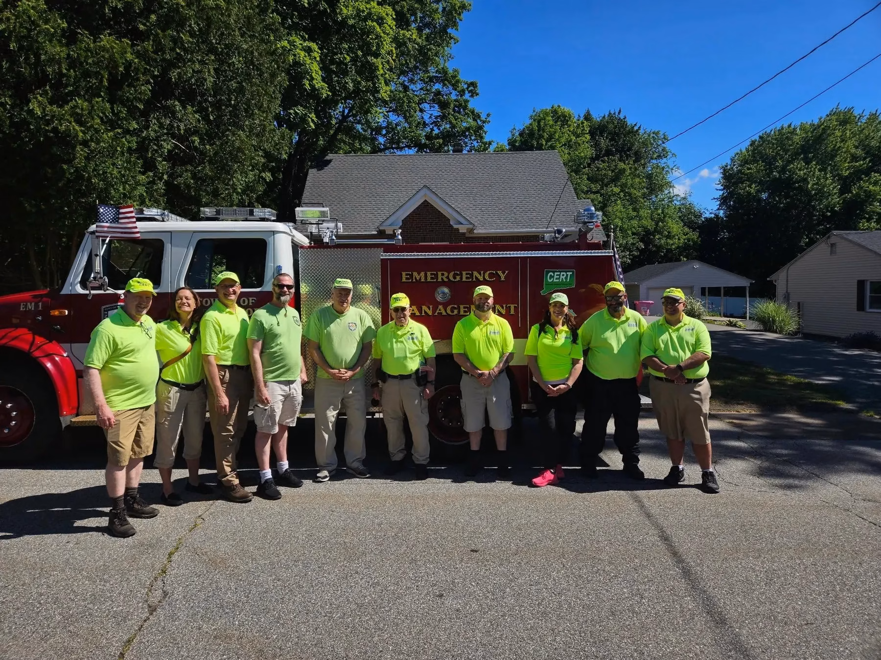 Wallingford CERT members standing in front of a fire engine